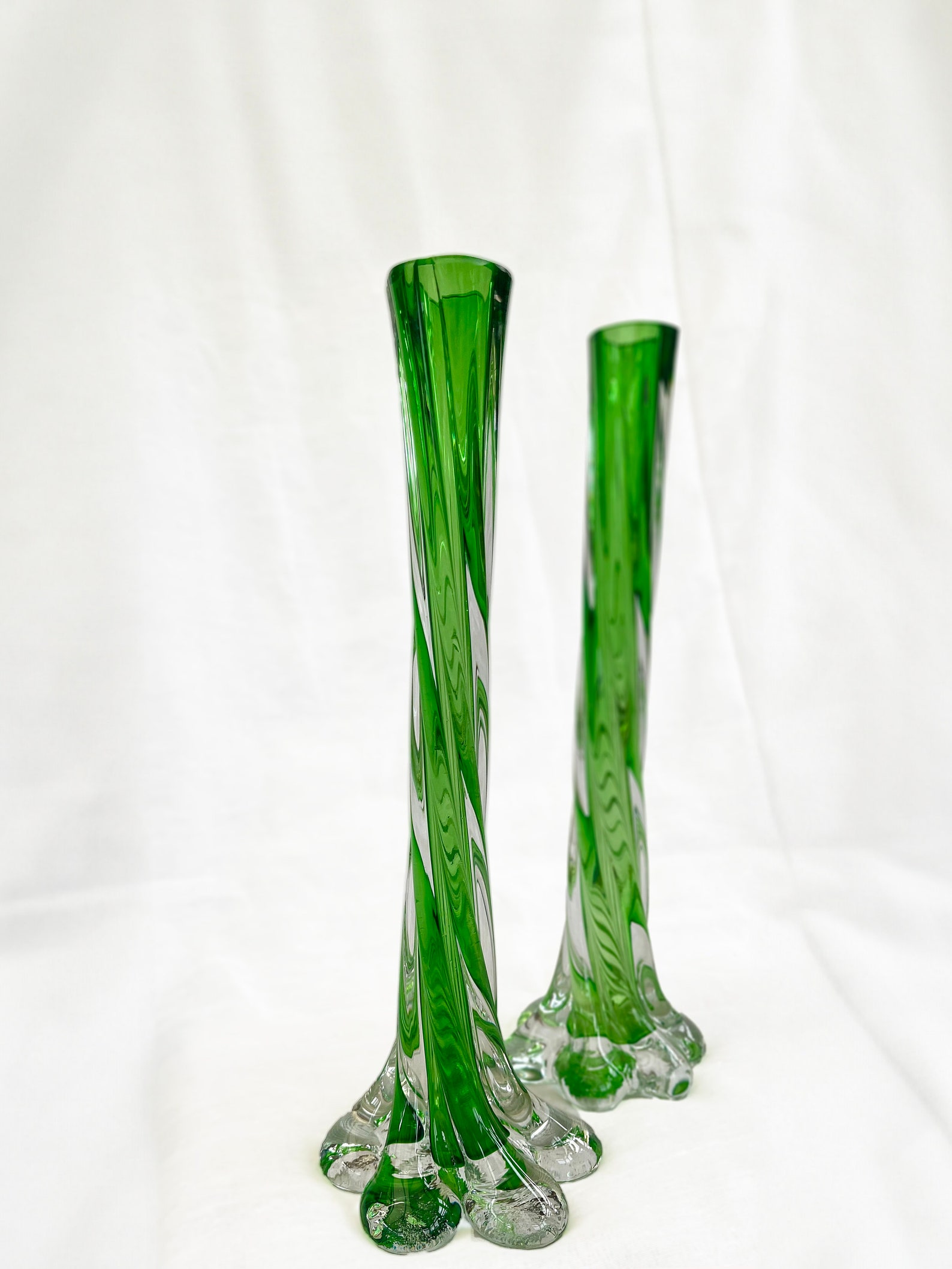 A pair of Uranium green French vintage twist stem vases. Art glass flower sleeves, circa 1950.