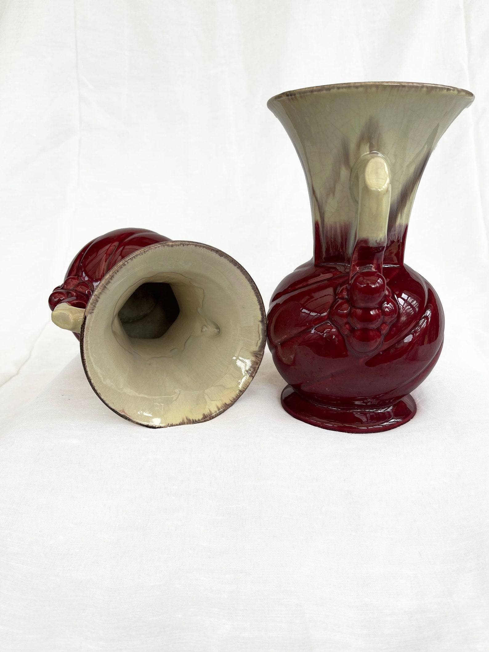 An attractive pair of Mid century fat lava glaze German handled vases