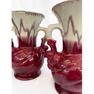 An attractive pair of Mid century fat lava glaze German handled vases