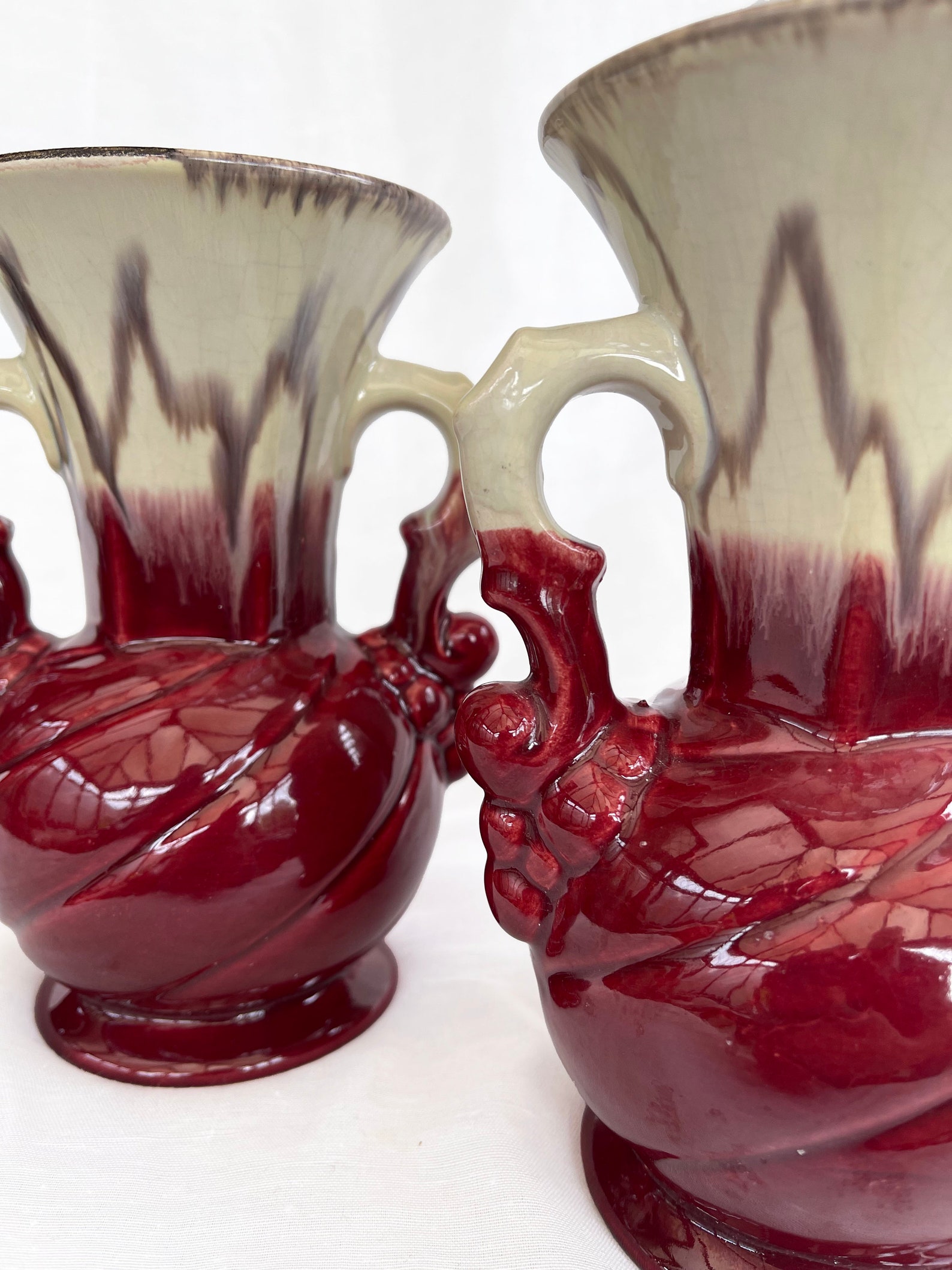 An attractive pair of Mid century fat lava glaze German handled vases