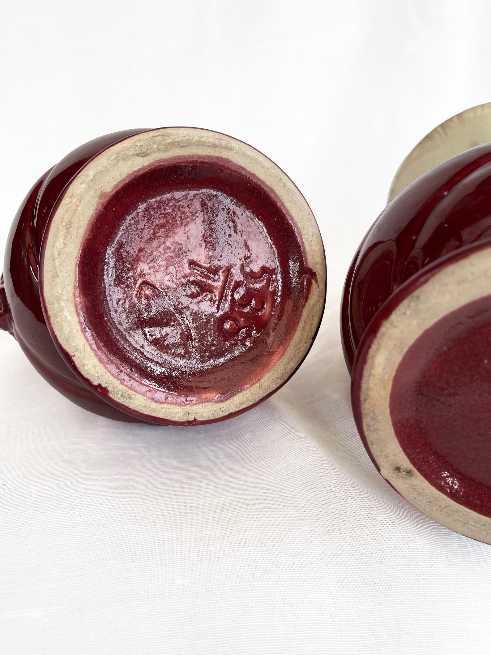An attractive pair of Mid century fat lava glaze German handled vases