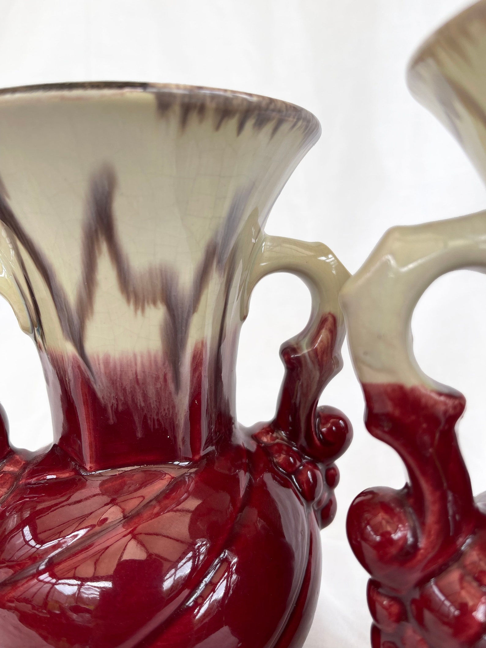 An attractive pair of Mid century fat lava glaze German handled vases