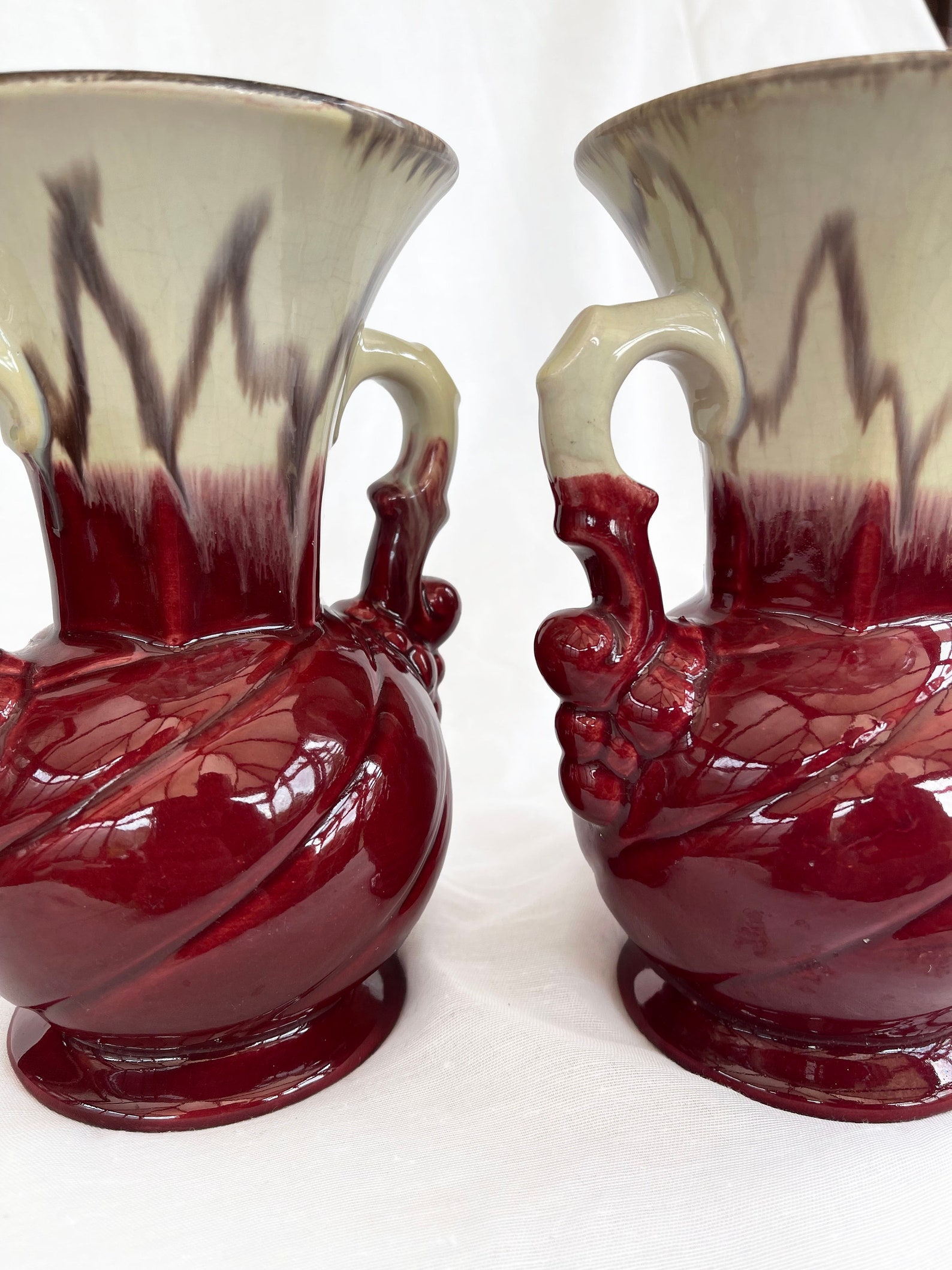 An attractive pair of Mid century fat lava glaze German handled vases
