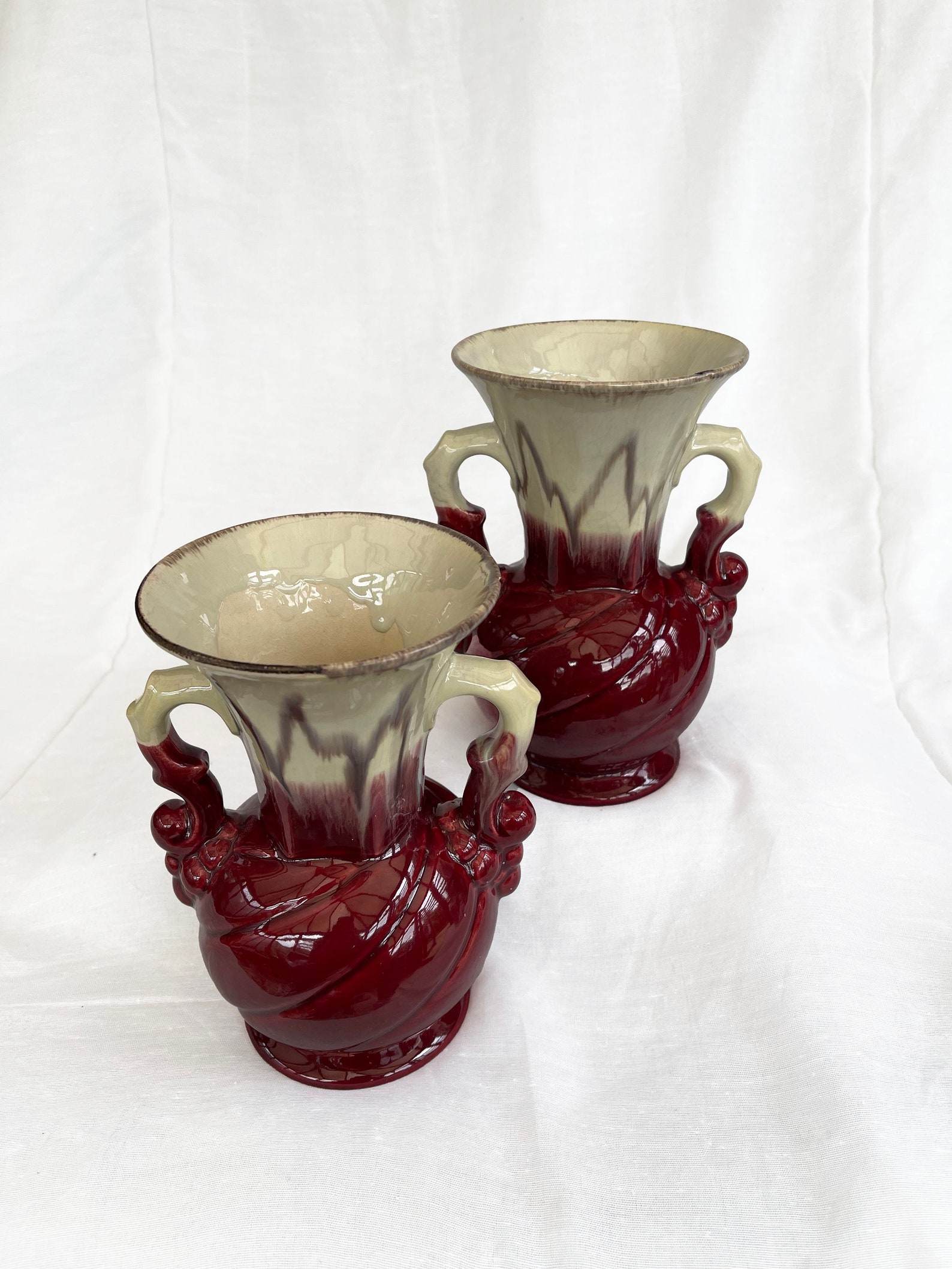 An attractive pair of Mid century fat lava glaze German handled vases