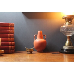 Ancient red-ware Roman amphoriskos. Antique terracotta.