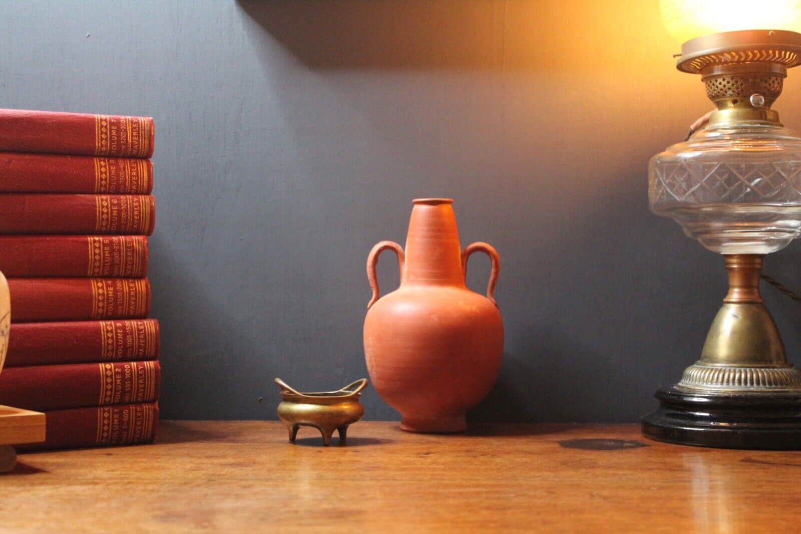 Ancient red-ware Roman amphoriskos. Antique terracotta.