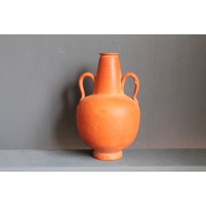 Ancient red-ware Roman amphoriskos. Antique terracotta.