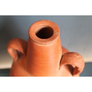 Ancient red-ware Roman amphoriskos. Antique terracotta.