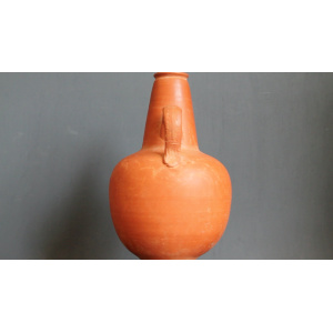 Ancient red-ware Roman amphoriskos. Antique terracotta.