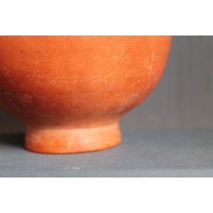 Ancient red-ware Roman amphoriskos. Antique terracotta.