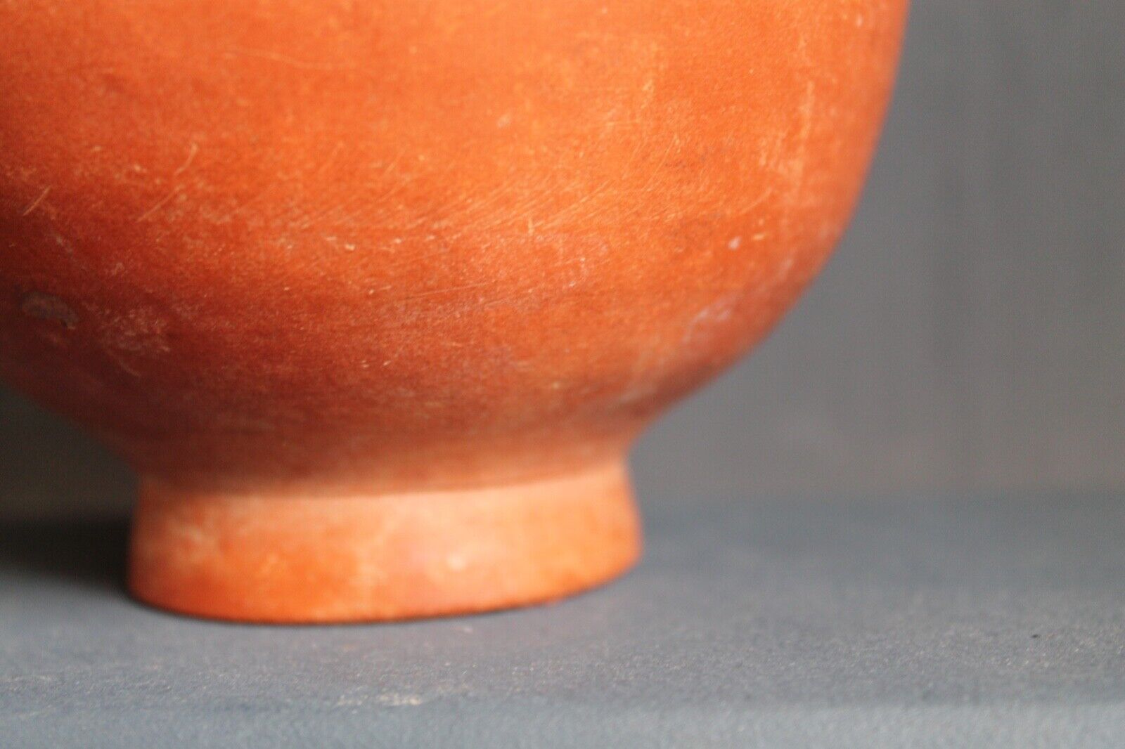 Ancient red-ware Roman amphoriskos. Antique terracotta.