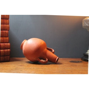 Ancient red-ware Roman amphoriskos. Antique terracotta.