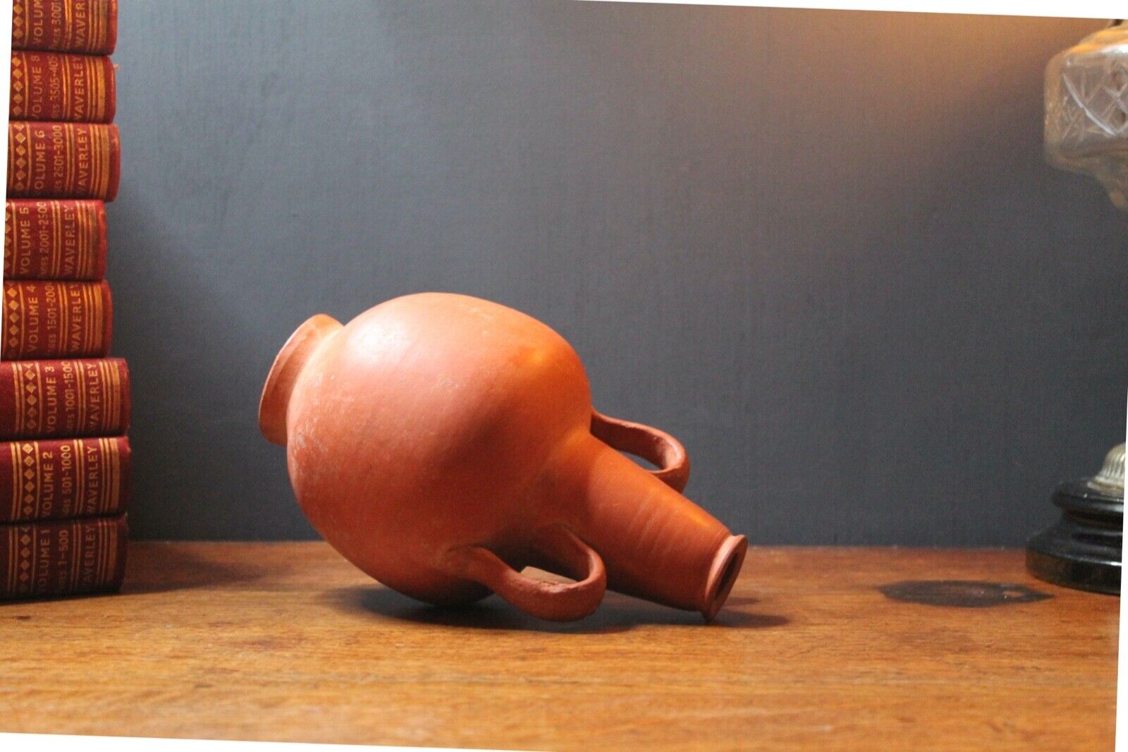 Ancient red-ware Roman amphoriskos. Antique terracotta.