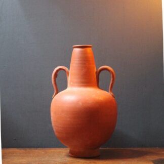 Ancient red-ware Roman amphoriskos. Antique terracotta.