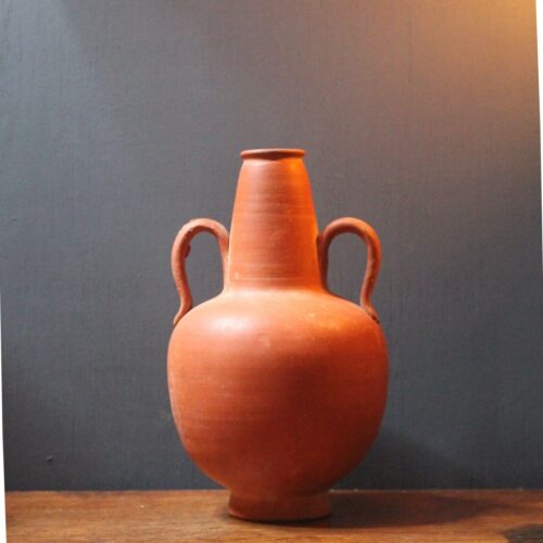 Ancient red-ware Roman amphoriskos. Antique terracotta.