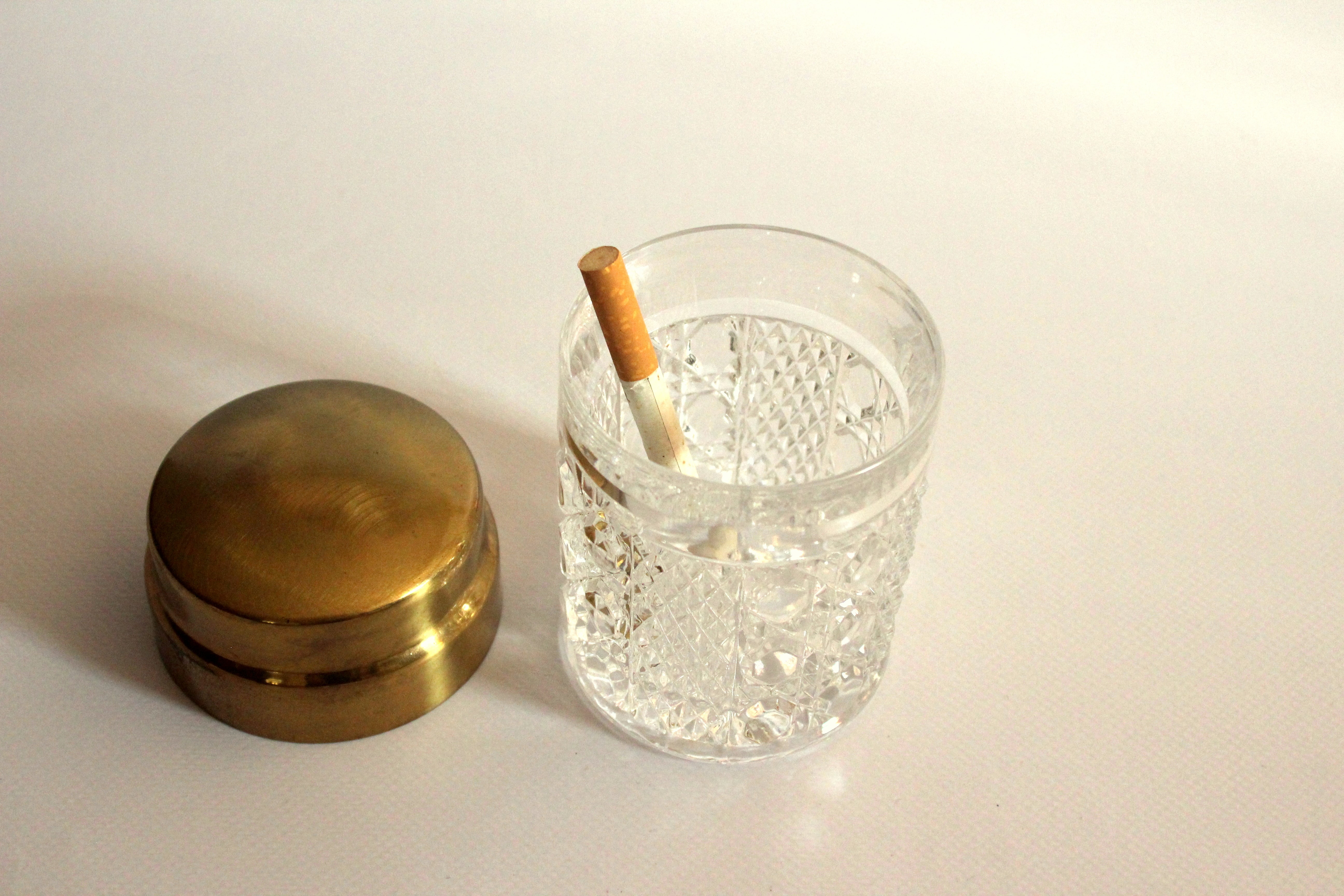 Elegant cigarette box from the 60s, made of crystal glass and brass lid, vintage