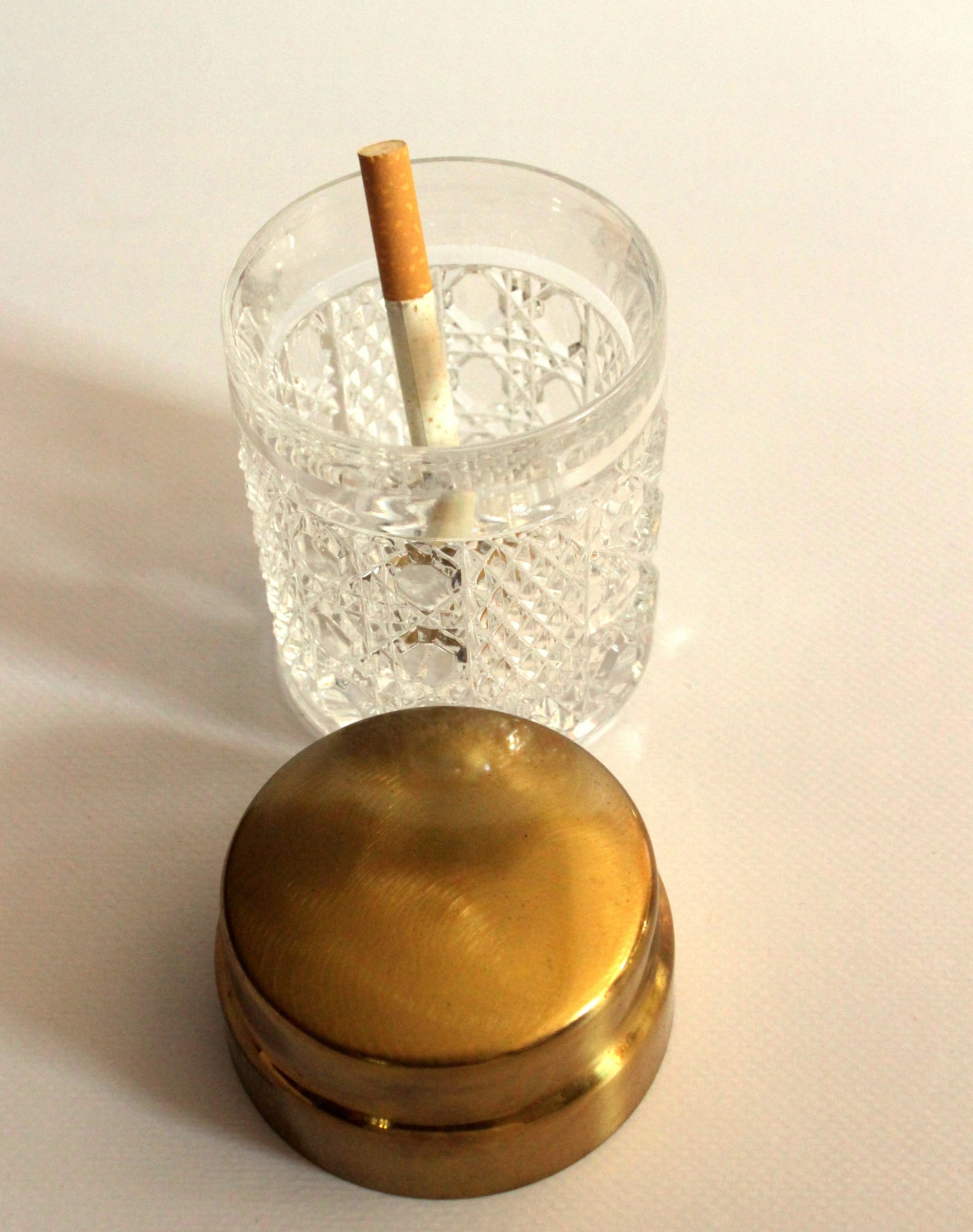 Elegant cigarette box from the 60s, made of crystal glass and brass lid, vintage