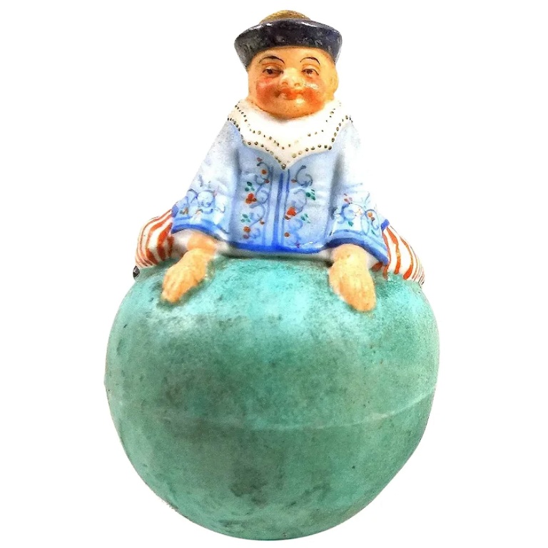 A rare antique coloured bisque porcelain novelty Roly Poly Clown Figure C.1900+