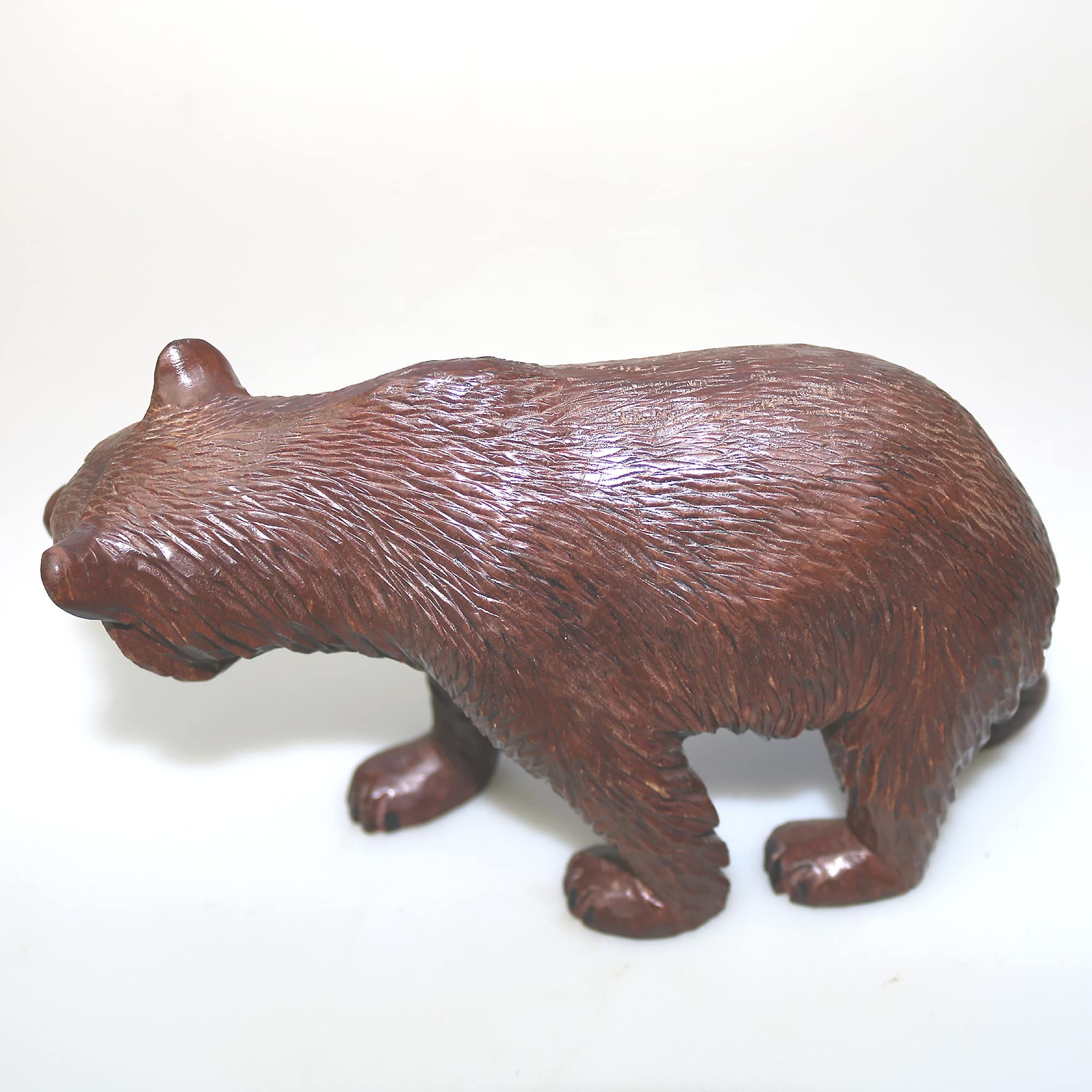 A large antique Swiss Black Forest hand-carved wooden Walking Bear C.20thC