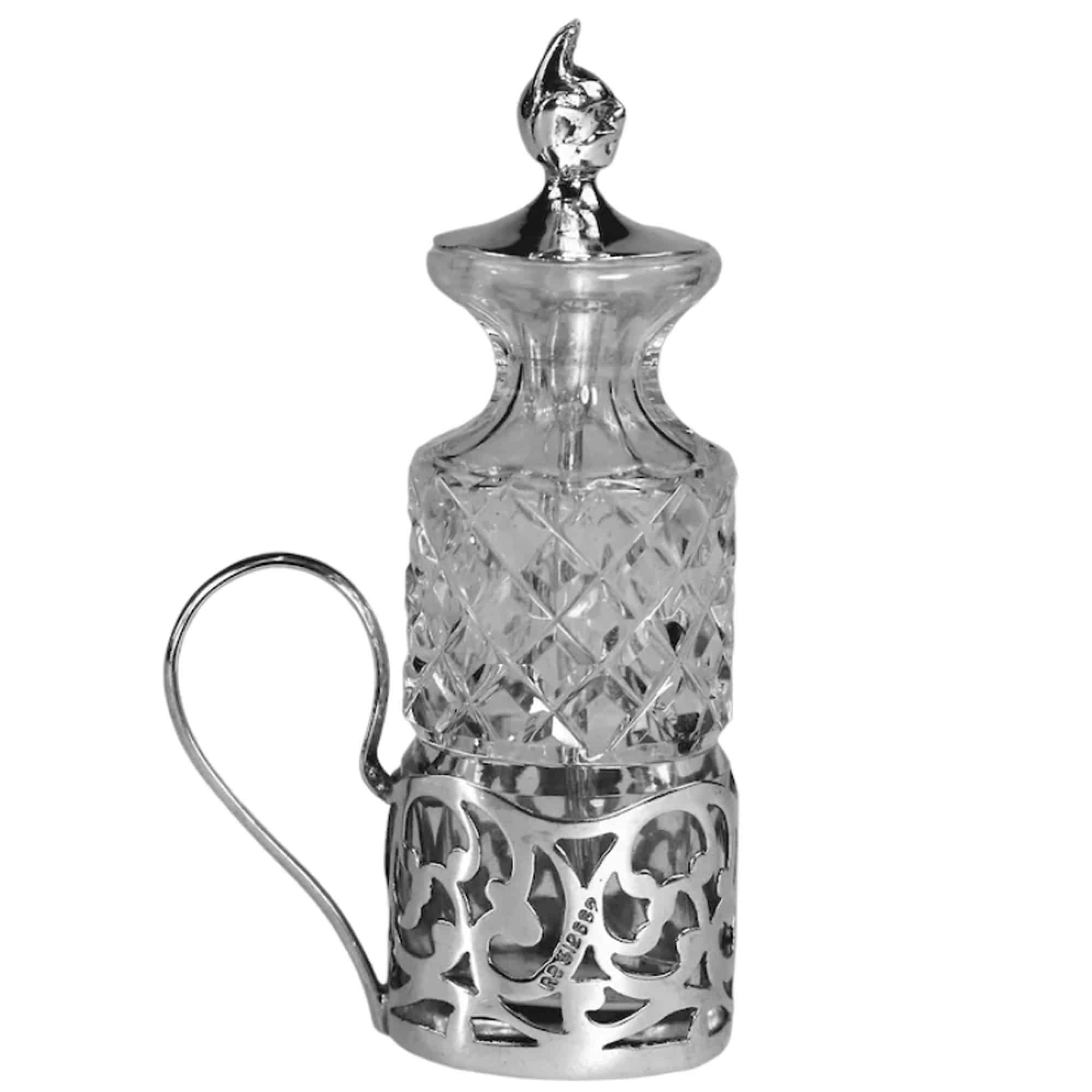 An antique solid silver & cut glass novelty Devil Cayenne Pepper Bottle C.1915