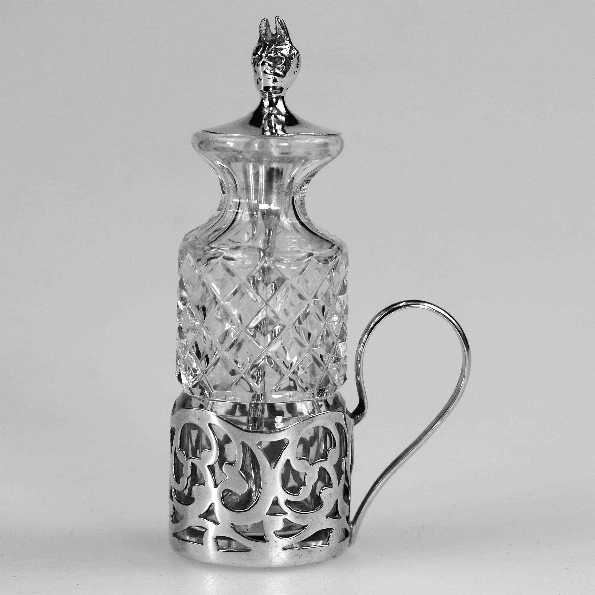 An antique solid silver & cut glass novelty Devil Cayenne Pepper Bottle C.1915