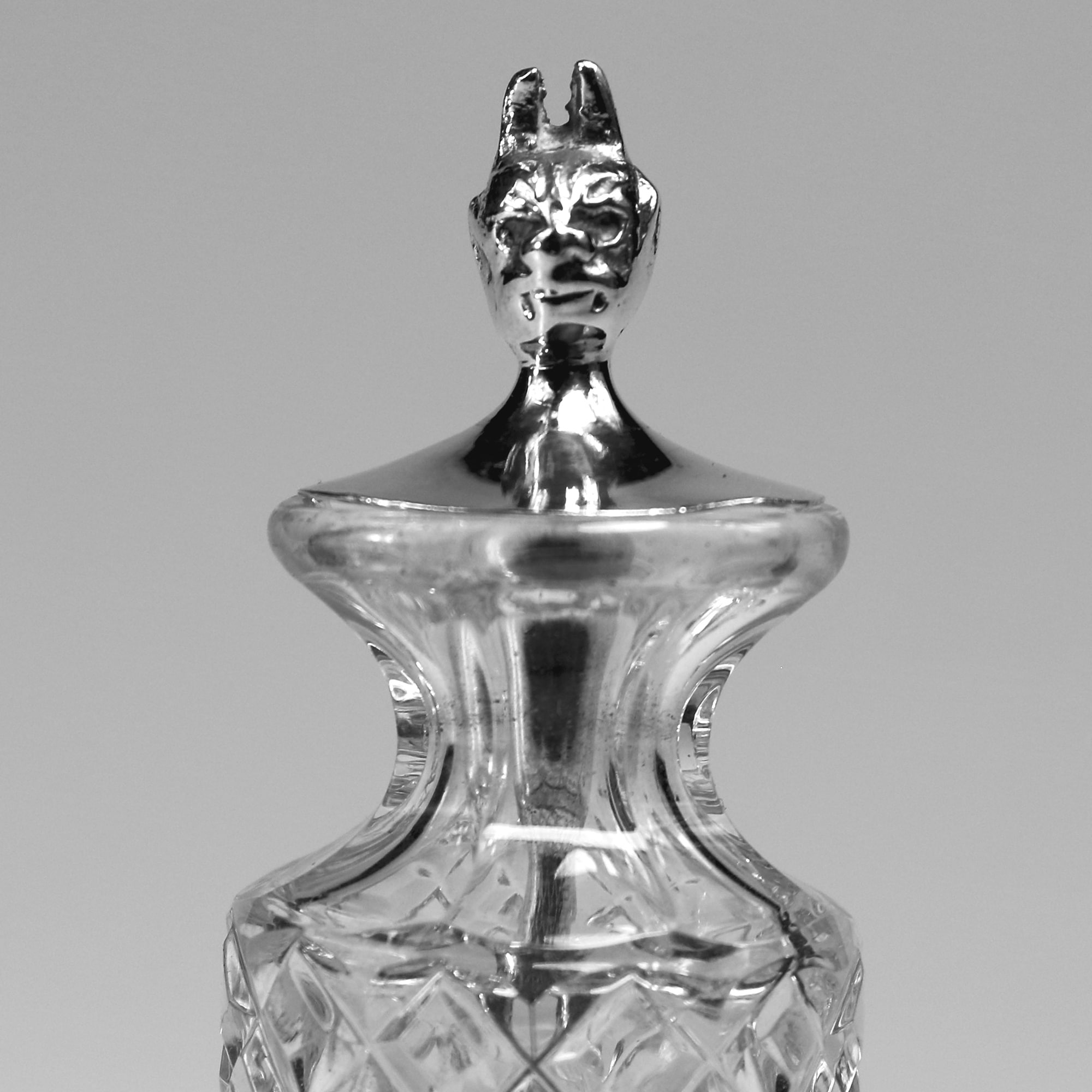 An antique solid silver & cut glass novelty Devil Cayenne Pepper Bottle C.1915