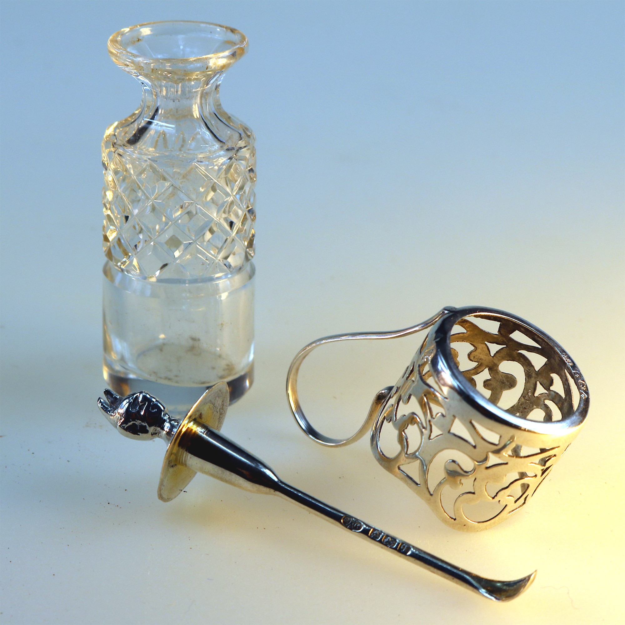 An antique solid silver & cut glass novelty Devil Cayenne Pepper Bottle C.1915