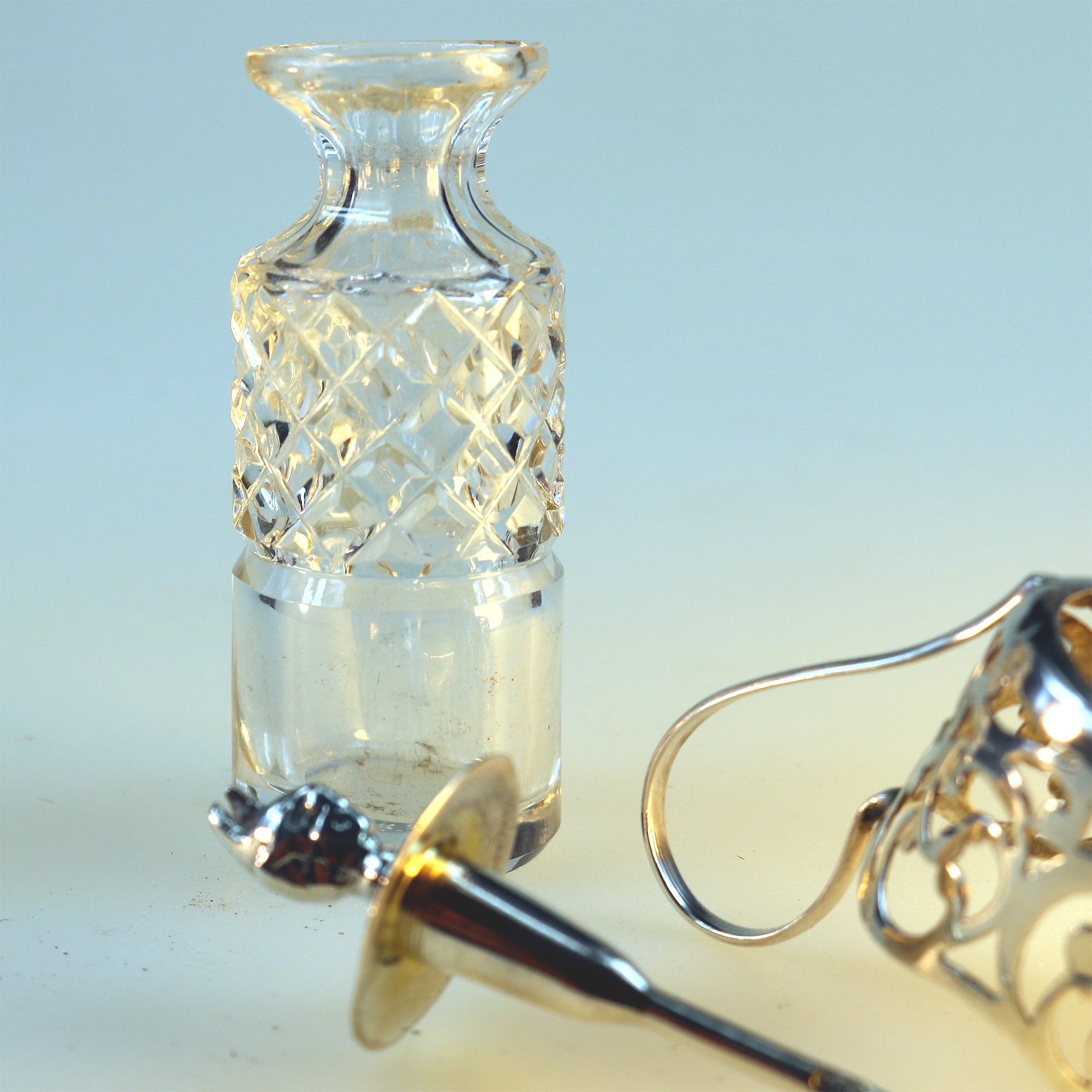 An antique solid silver & cut glass novelty Devil Cayenne Pepper Bottle C.1915