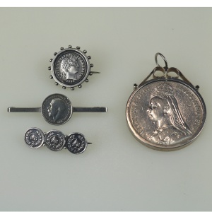 A collection of antique silver Coin Jewellery pendant & Brooches of various dates