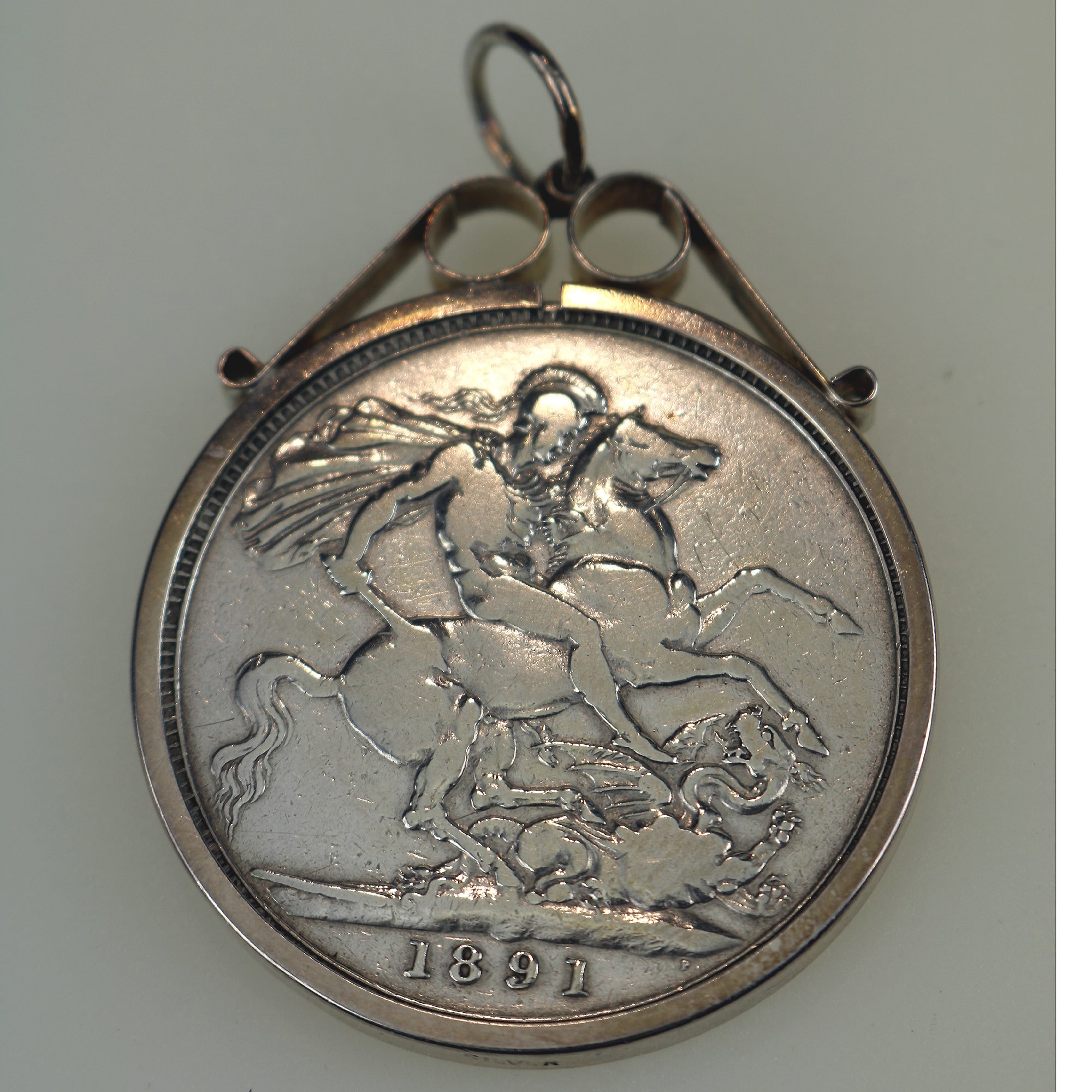 A collection of antique silver Coin Jewellery pendant & Brooches of various dates