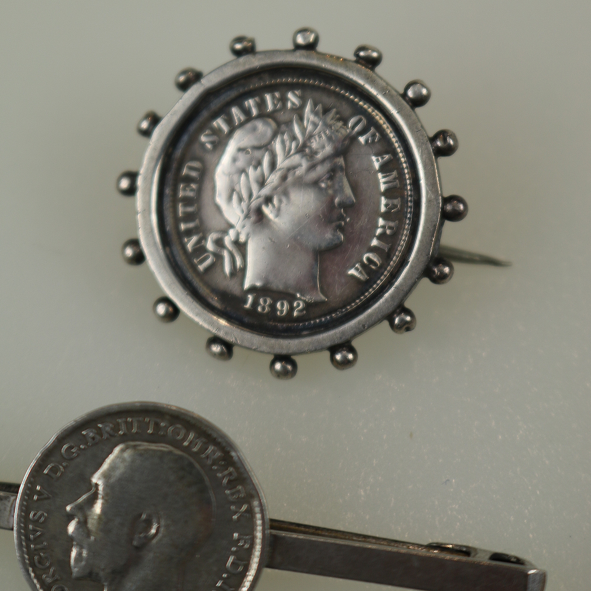 A collection of antique silver Coin Jewellery pendant & Brooches of various dates