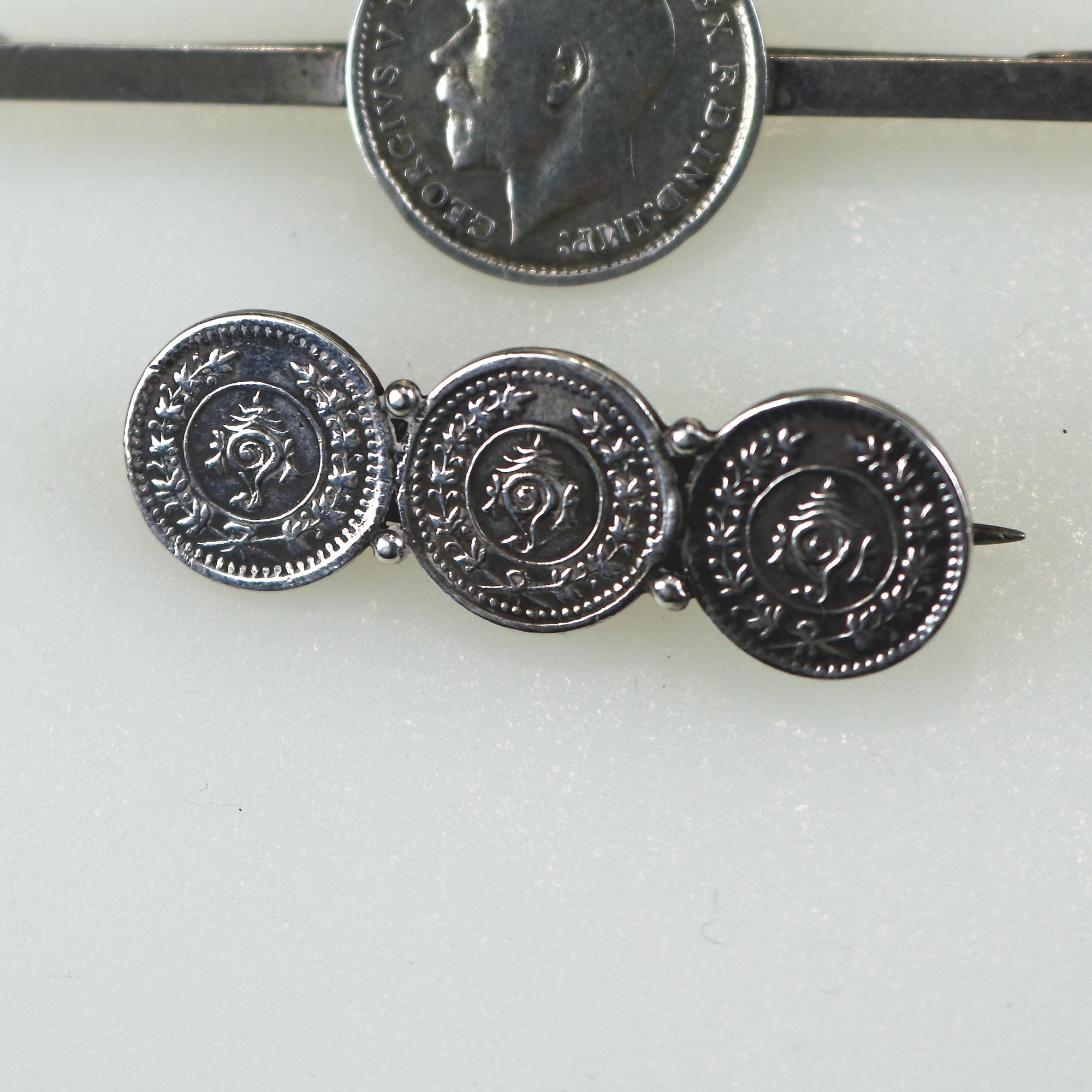 A collection of antique silver Coin Jewellery pendant & Brooches of various dates