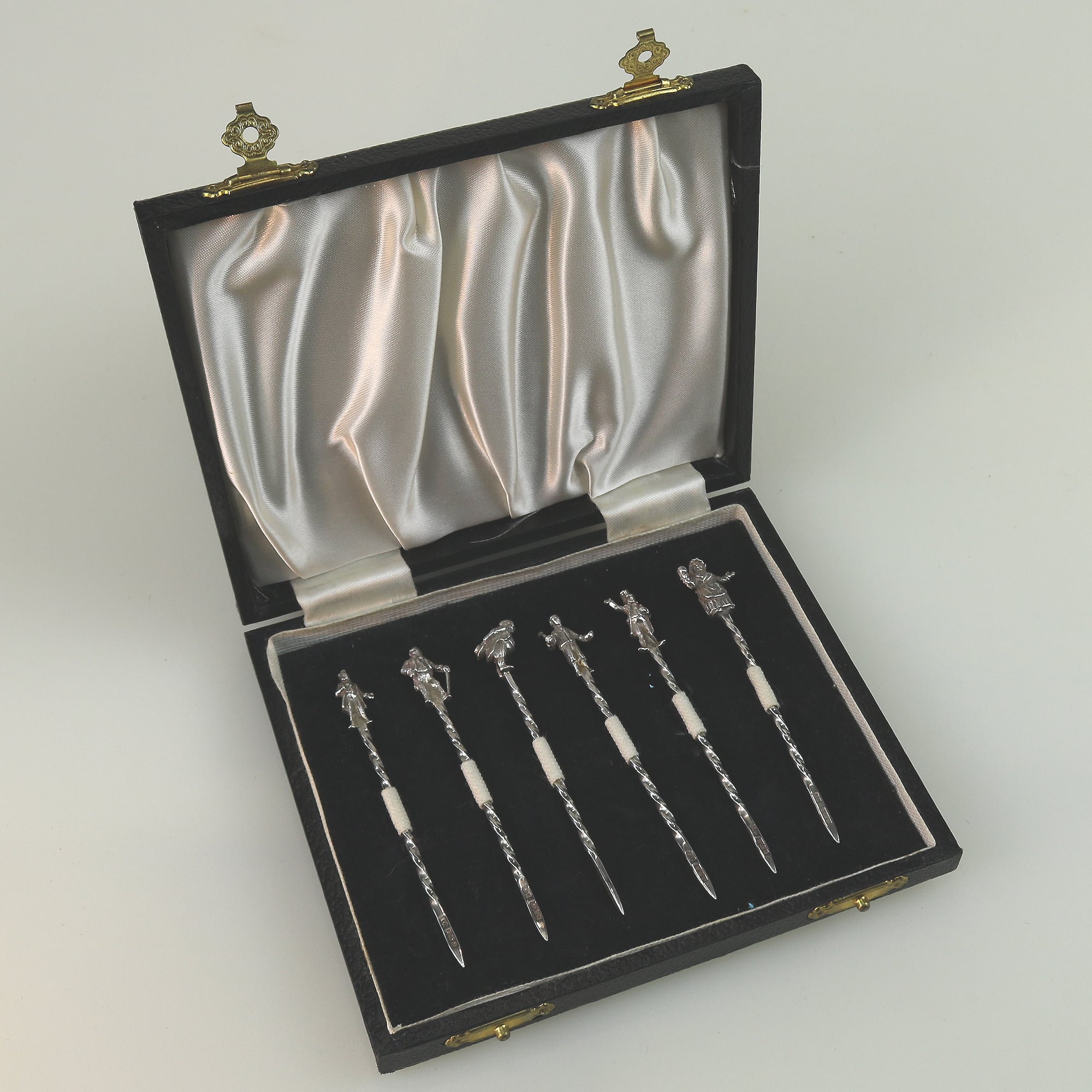 A set of novelty English solid silver Charles Dickens Characters Cocktail Sticks 1973