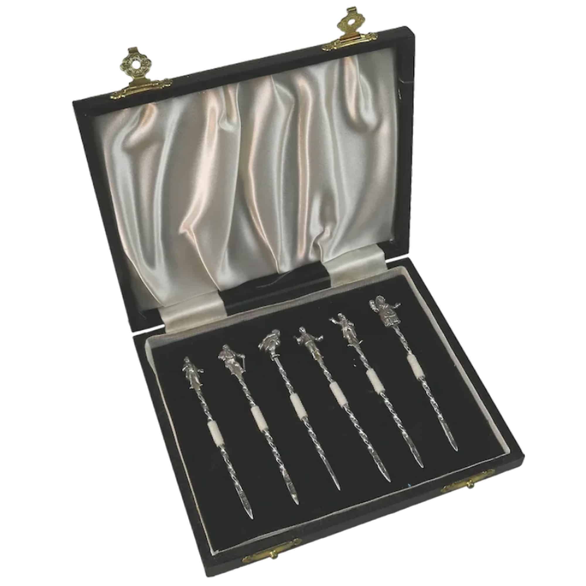 A set of novelty English solid silver Charles Dickens Characters Cocktail Sticks 1973