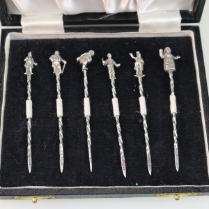 A set of novelty English solid silver Charles Dickens Characters Cocktail Sticks 1973