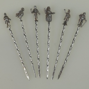 A set of novelty English solid silver Charles Dickens Characters Cocktail Sticks 1973