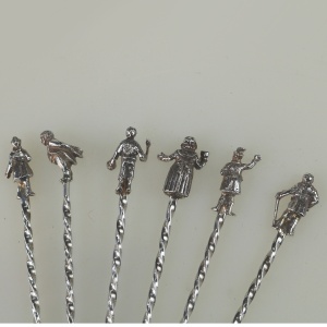 A set of novelty English solid silver Charles Dickens Characters Cocktail Sticks 1973