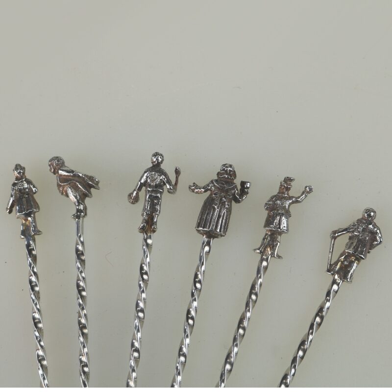 A set of novelty English solid silver Charles Dickens Characters Cocktail Sticks 1973