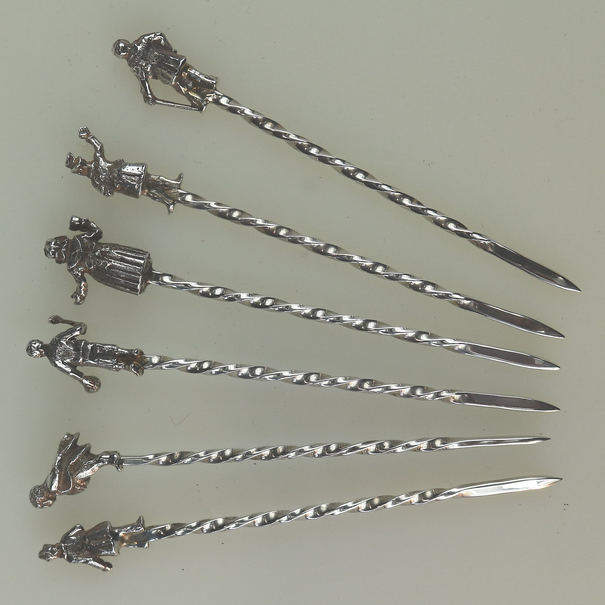 A set of novelty English solid silver Charles Dickens Characters Cocktail Sticks 1973