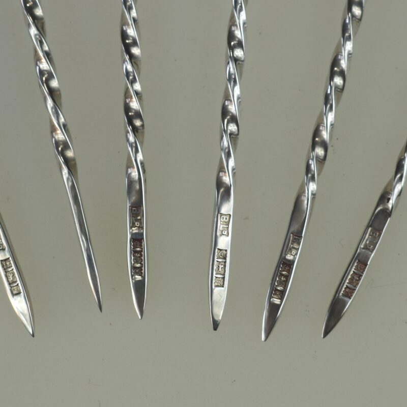 A set of novelty English solid silver Charles Dickens Characters Cocktail Sticks 1973