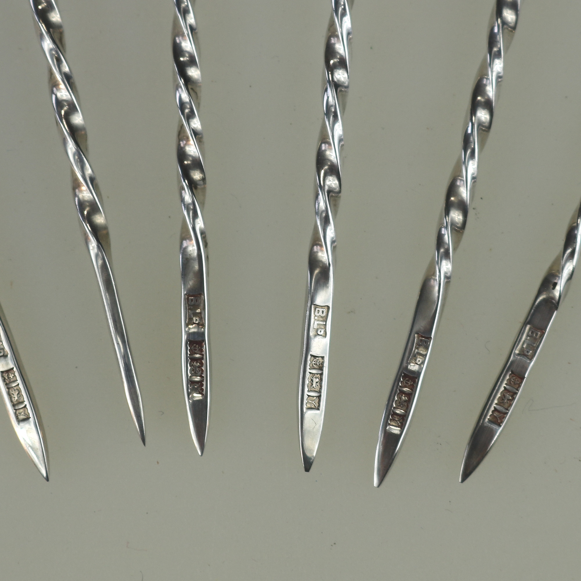 A set of novelty English solid silver Charles Dickens Characters Cocktail Sticks 1973