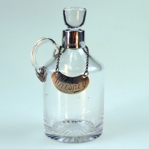 An antique novelty English solid silver & blown glass Whiskey Noggin C.1908