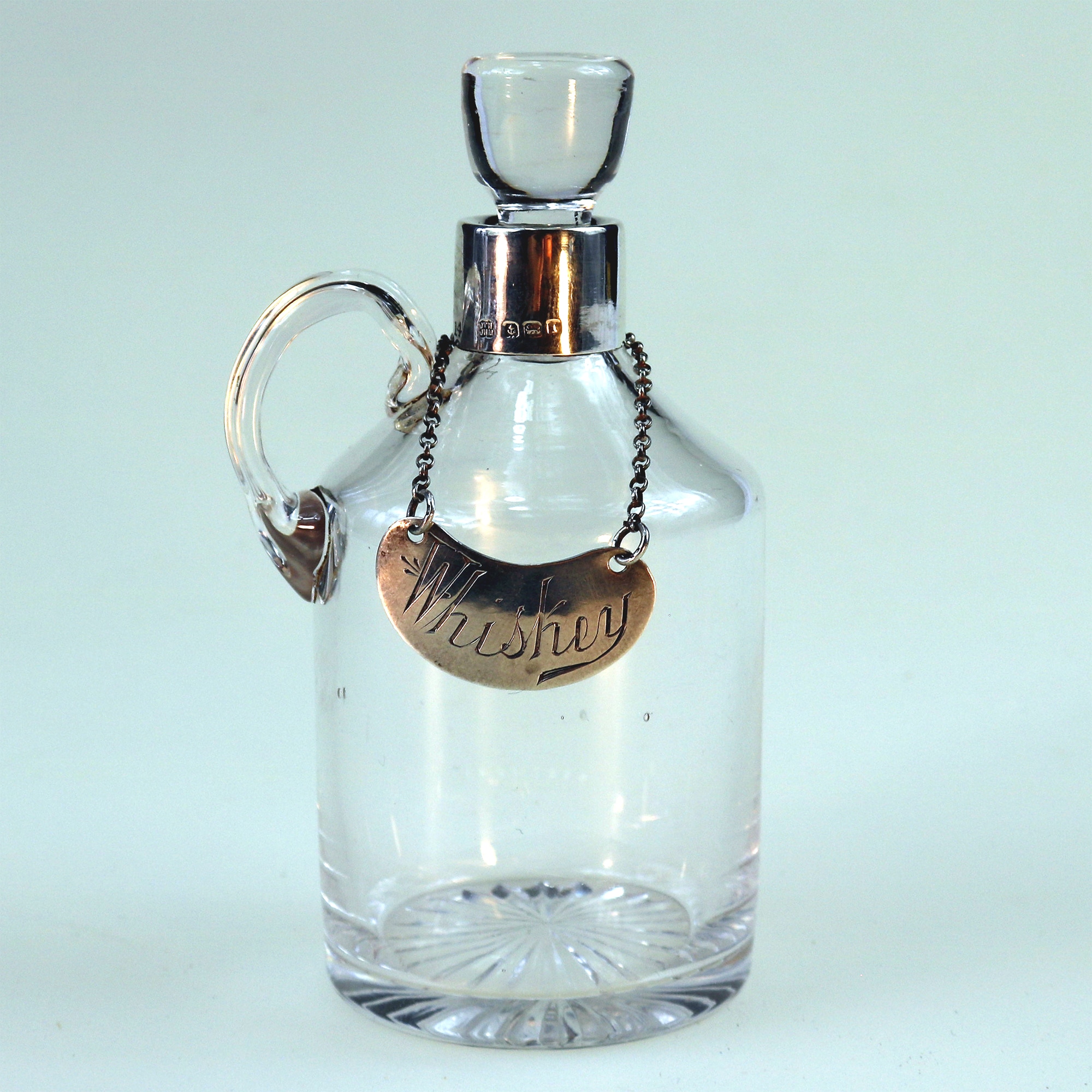 An antique novelty English solid silver & blown glass Whiskey Noggin C.1908