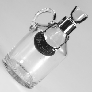 An antique novelty English solid silver & blown glass Whiskey Noggin C.1908