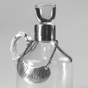 An antique novelty English solid silver & blown glass Whiskey Noggin C.1908