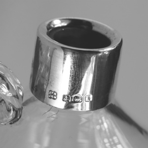 An antique novelty English solid silver & blown glass Whiskey Noggin C.1908