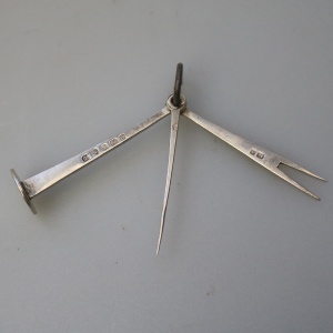 An antique English solid silver novelty pipe tamper & picks tools C.1903