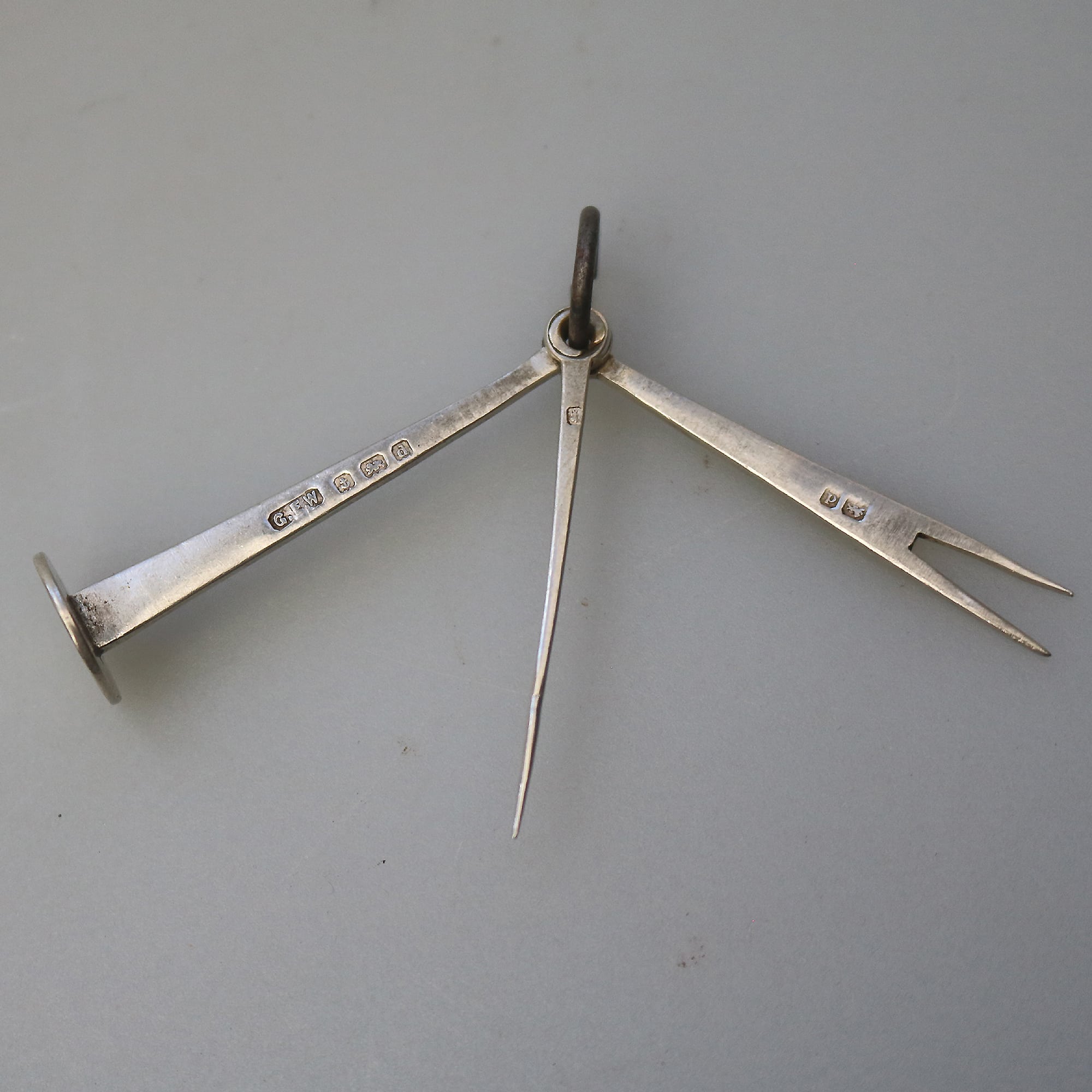 An antique English solid silver novelty pipe tamper & picks tools C.1903