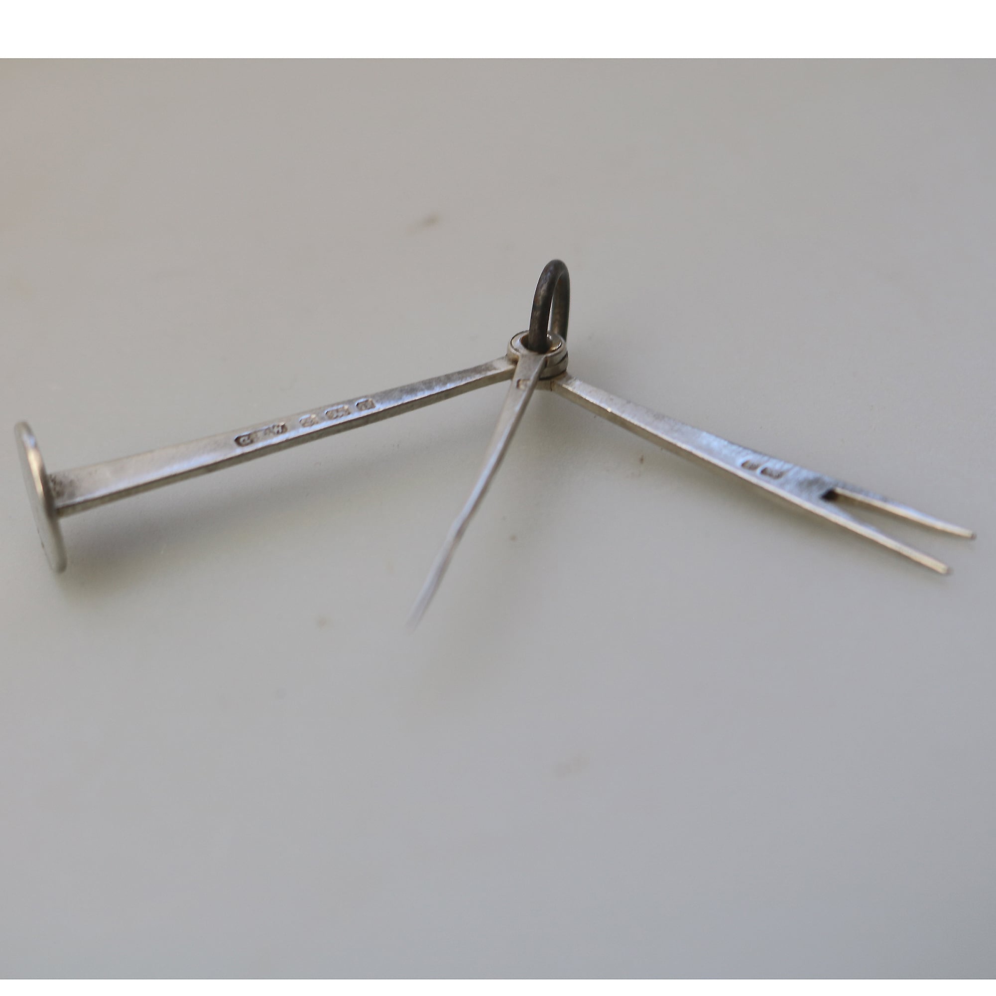 An antique English solid silver novelty pipe tamper & picks tools C.1903