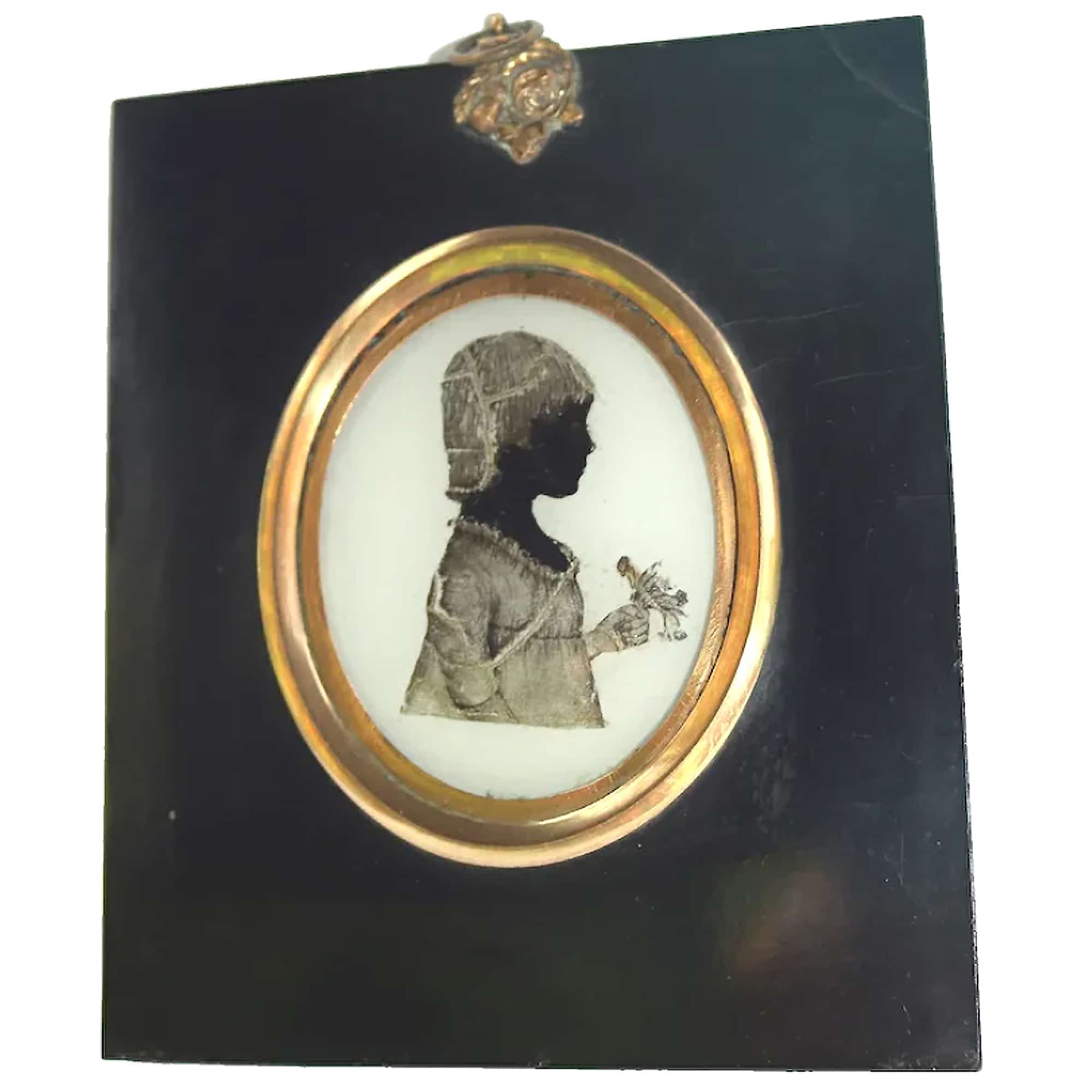 An unusual antique reverse painted on glass Portrait Miniature Silhouette C.19thC